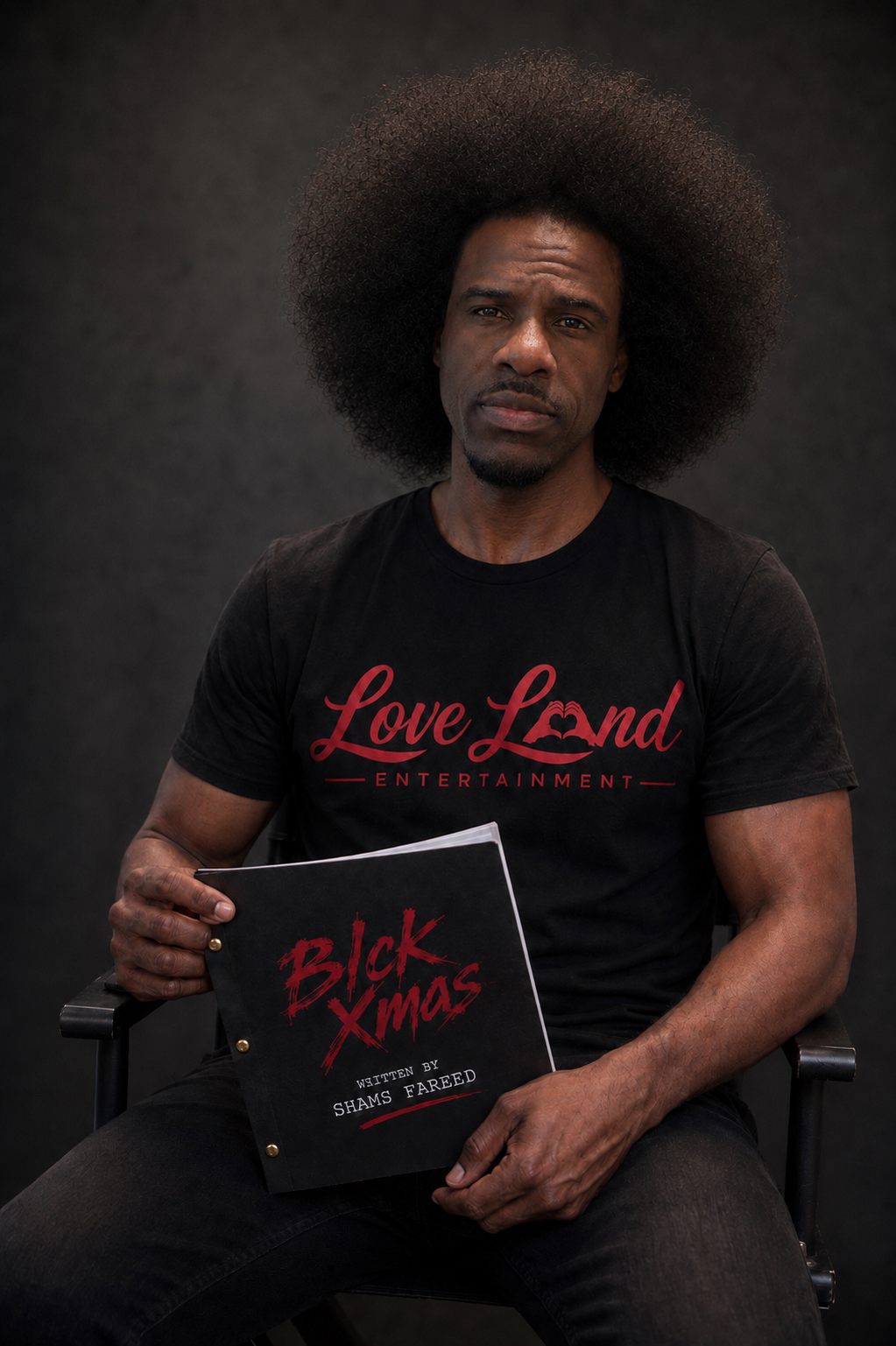 Shams Fareed, creator of Blck Xmas, holding the Blck Xmas screenplay